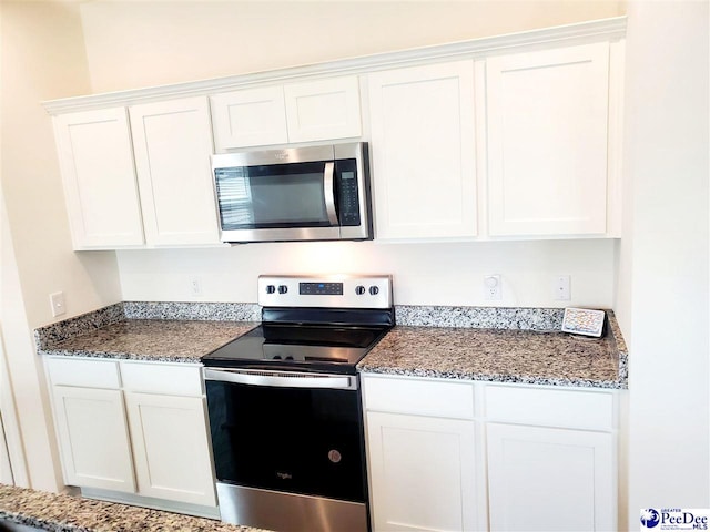 583 Polaris Way, Summerville, SC 29486 - kitchen with stainless steel appliances, white cabinets, and stone counters