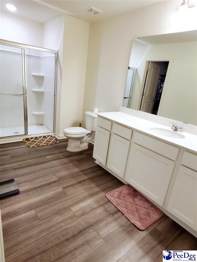 583 Polaris Way, Summerville, SC 29486 - bathroom featuring a stall shower, wood finished floors, vanity, and toilet