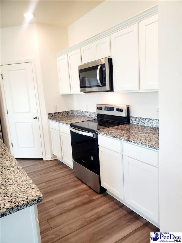 583 Polaris Way, Summerville, SC 29486 - kitchen with stainless steel appliances, white cabinetry, and wood finished floors