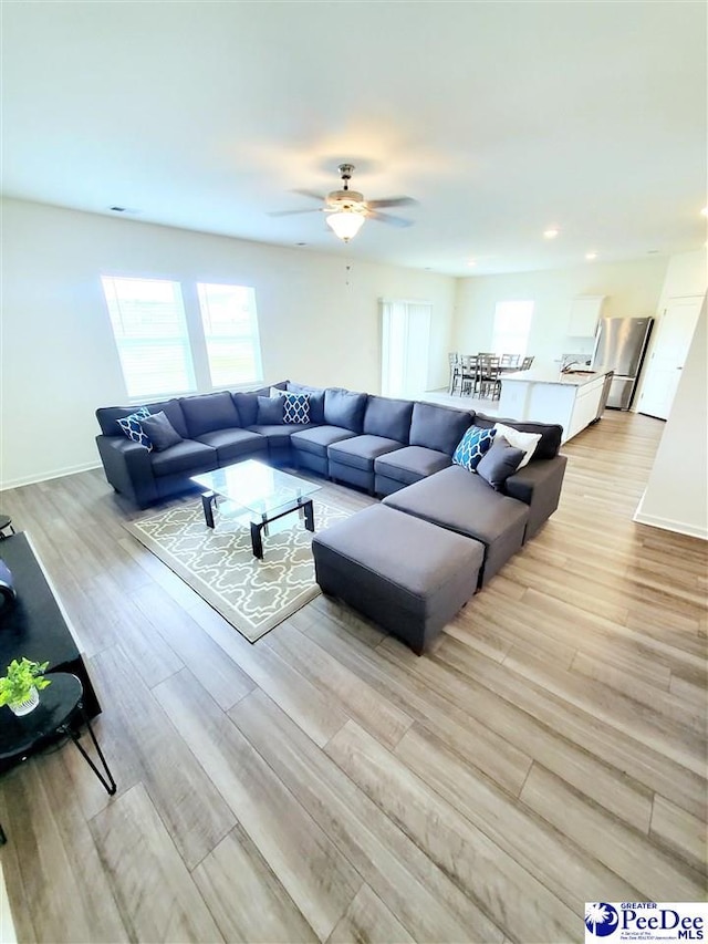 583 Polaris Way, Summerville, SC 29486 - living area with light wood-style flooring, a ceiling fan, recessed lighting, and baseboards