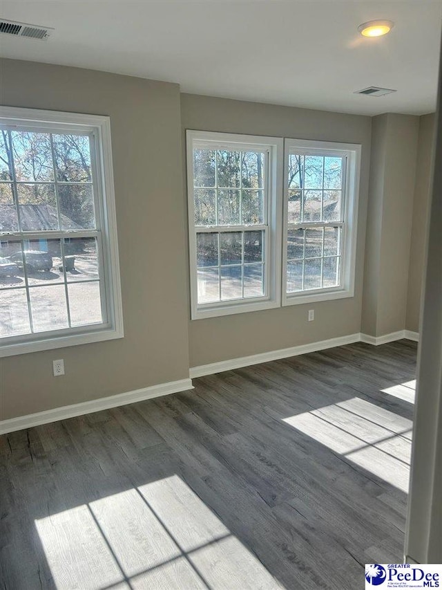 1001/1003 Jessamine Trl, Sumter, SC 29150 - unfurnished room featuring dark wood-style flooring and baseboards