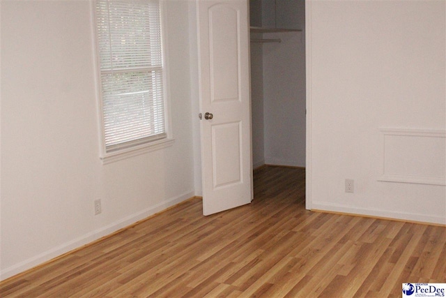 unfurnished bedroom with light hardwood / wood-style flooring