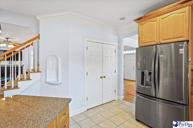 2543 Ben Hogan Cir, Florence, SC 29506 - kitchen featuring stainless steel refrigerator with ice dispenser, crown molding, dark stone countertops, light tile patterned flooring, and ceiling fan