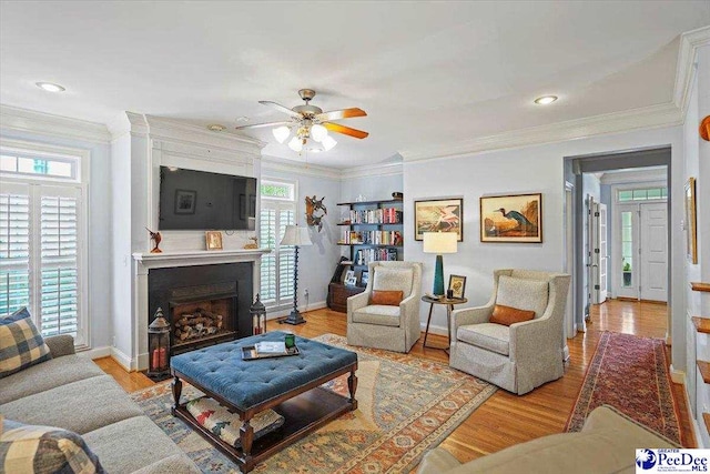 2543 Ben Hogan Cir, Florence, SC 29506 - living area with ornamental molding and light wood finished floors