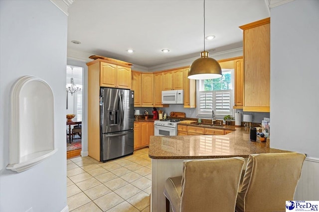 2543 Ben Hogan Cir, Florence, SC 29506 - kitchen with a sink, a chandelier, a peninsula, light tile patterned floors, and white appliances