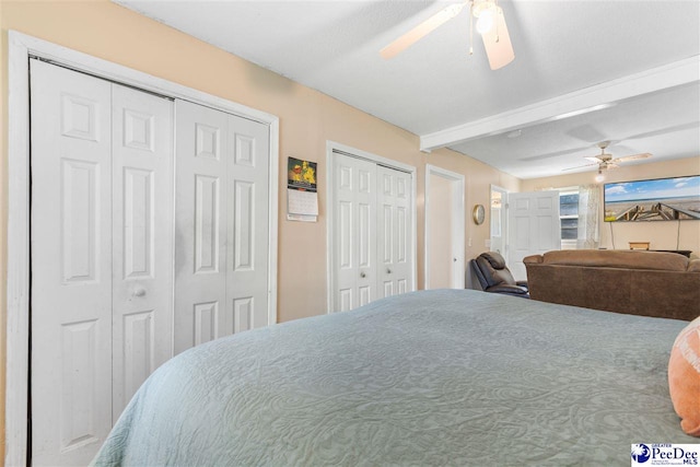 3518 Leigh Ln, Florence, SC 29505 - bedroom with two closets, beamed ceiling, and a ceiling fan