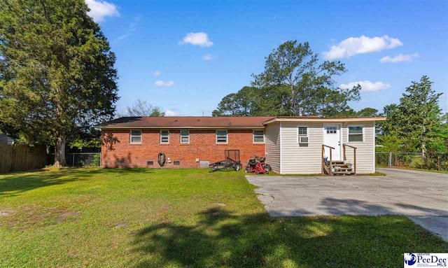 3518 Leigh Ln, Florence, SC 29505 - rear view of house with entry steps, a patio, and brick siding