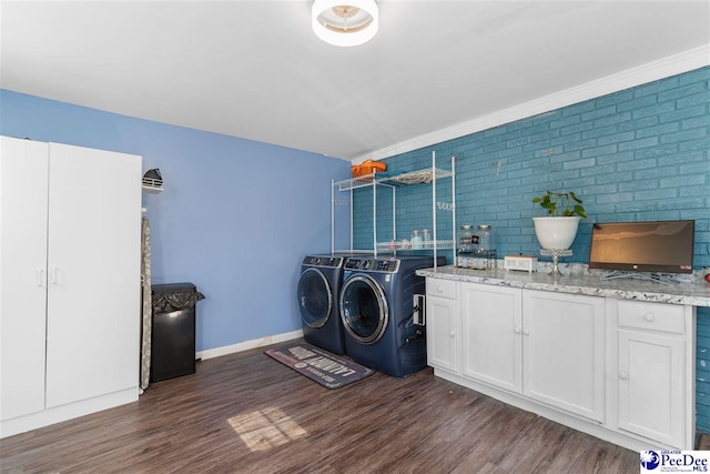 3518 Leigh Ln, Florence, SC 29505 - laundry area with independent washer and dryer, dark wood-type flooring, cabinet space, and baseboards