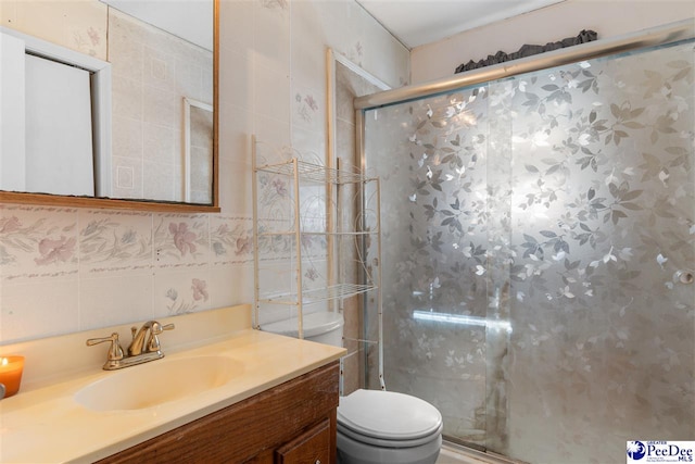 3518 Leigh Ln, Florence, SC 29505 - bathroom with tile walls, toilet, a shower stall, vanity, and backsplash