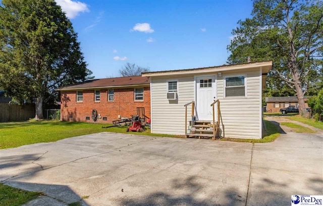 3518 Leigh Ln, Florence, SC 29505 - rear view of property featuring entry steps, a patio area, and cooling unit