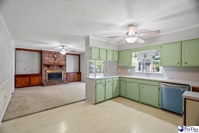 kitchen with a healthy amount of sunlight, sink, dishwasher, and green cabinets