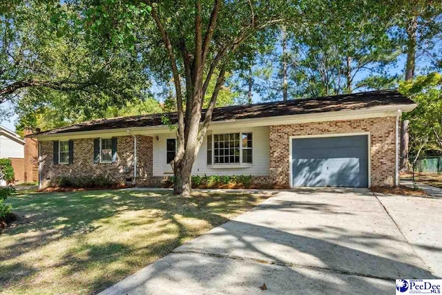 ranch-style house with a garage and a front yard