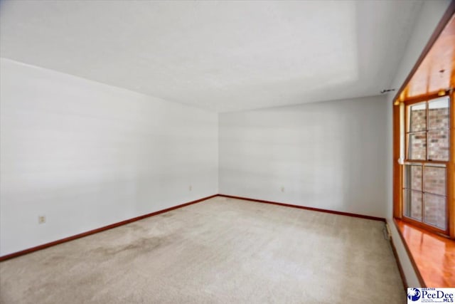 empty room featuring carpet flooring