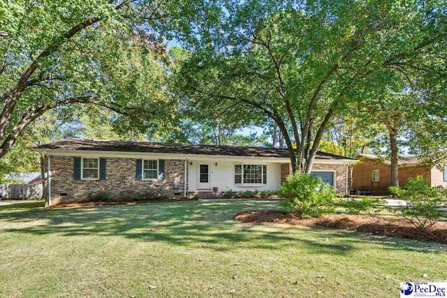 ranch-style home featuring a front yard