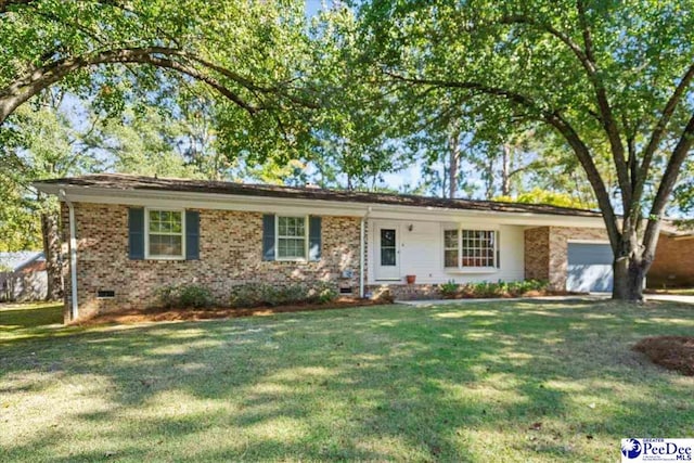 ranch-style house with a garage and a front yard