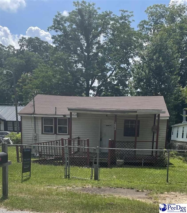 1002 N Brand St, Florence, SC 29506 - view of front of home with a fenced front yard and covered porch