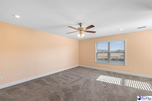 carpeted empty room with ceiling fan