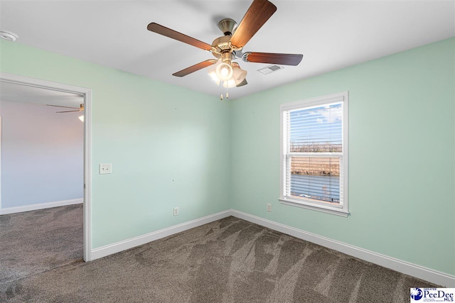 carpeted empty room with ceiling fan