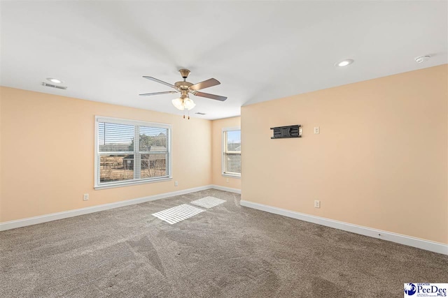 unfurnished room featuring carpet floors and ceiling fan