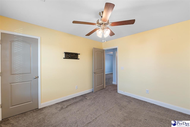 unfurnished bedroom featuring carpet flooring and ceiling fan