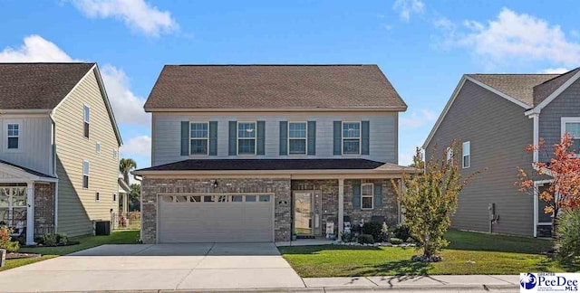 view of front facade featuring a garage and a front yard