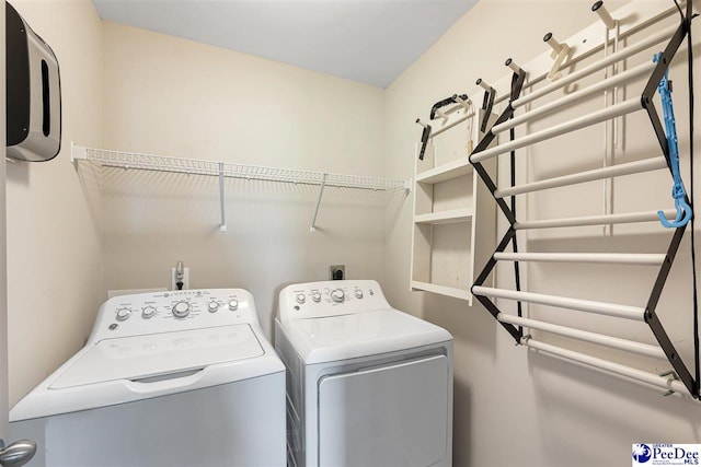 washroom featuring independent washer and dryer