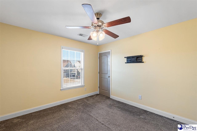 empty room featuring ceiling fan and carpet floors
