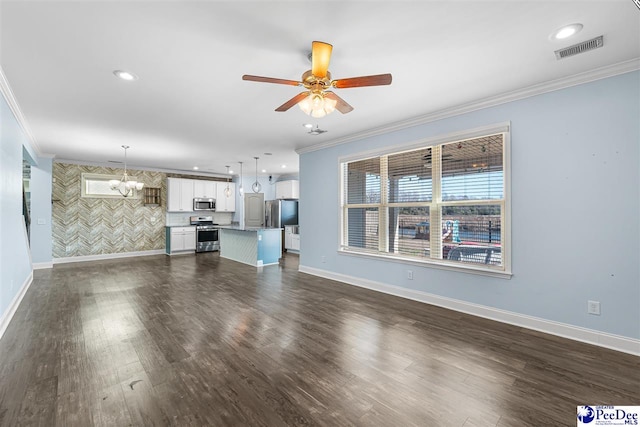 unfurnished living room featuring dark hardwood / wood-style flooring, crown molding, and ceiling fan with notable chandelier