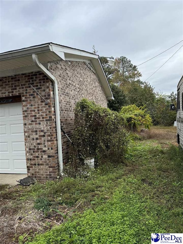 1343 Floyd Dr, Lake City, SC 29560 - view of side of property with a garage