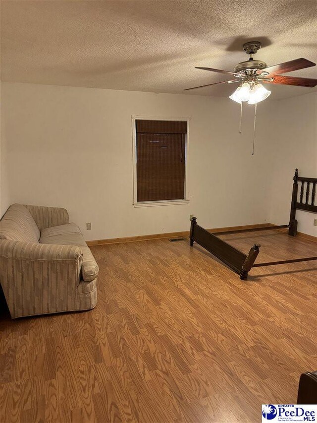 1343 Floyd Dr, Lake City, SC 29560 - living area with ceiling fan, light hardwood / wood-style flooring, and a textured ceiling