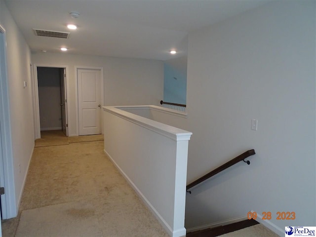 1671 Lake Wateree Dr, Florence, SC 29501 - corridor with an upstairs landing, light colored carpet, baseboards, and recessed lighting