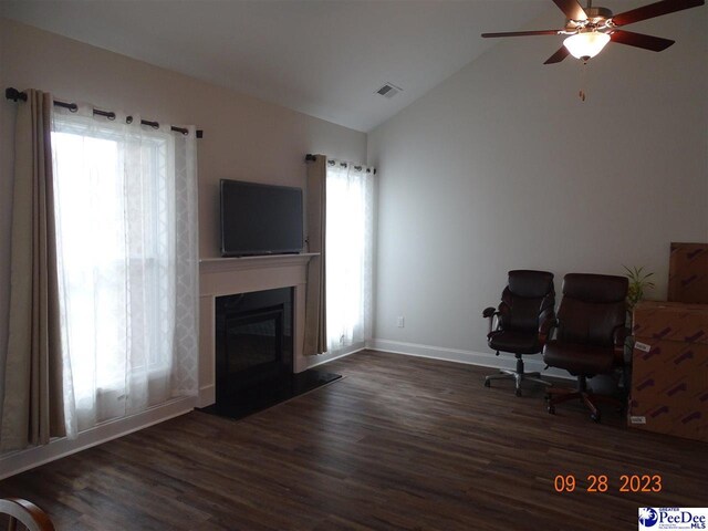 1671 Lake Wateree Dr, Florence, SC 29501 - home office with wood finished floors, a glass covered fireplace, ceiling fan, baseboards, and high vaulted ceiling