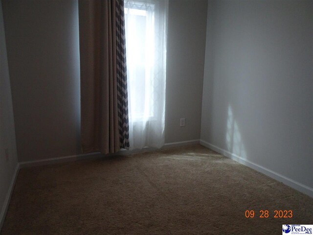 1671 Lake Wateree Dr, Florence, SC 29501 - empty room featuring carpet and baseboards