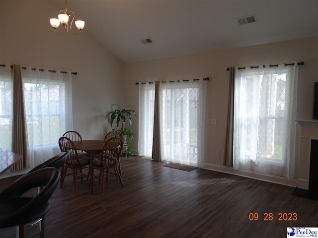 1671 Lake Wateree Dr, Florence, SC 29501 - dining space with wood finished floors, a chandelier, and high vaulted ceiling