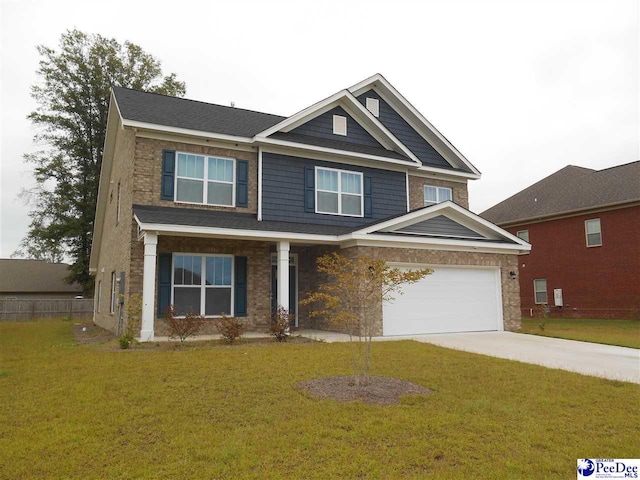 1671 Lake Wateree Dr, Florence, SC 29501 - craftsman house featuring driveway, a front yard, a garage, and stone siding