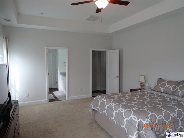1671 Lake Wateree Dr, Florence, SC 29501 - bedroom featuring carpet floors, a raised ceiling, baseboards, and a ceiling fan