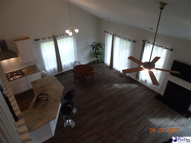 1671 Lake Wateree Dr, Florence, SC 29501 - dining room with wood finished floors, plenty of natural light, ceiling fan, and high vaulted ceiling