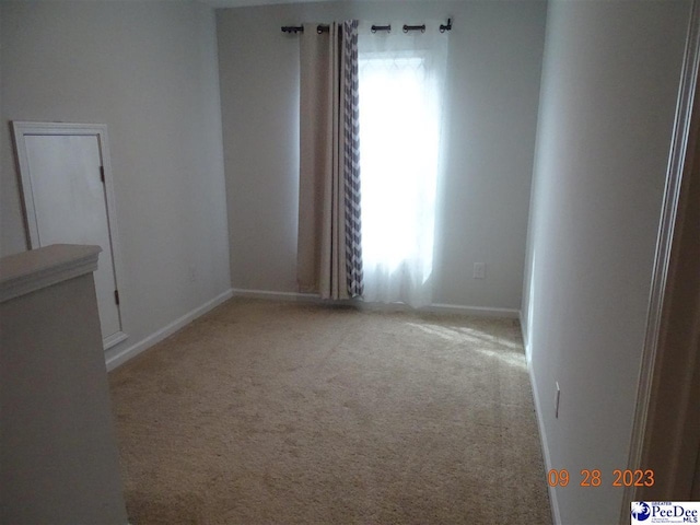 1671 Lake Wateree Dr, Florence, SC 29501 - spare room featuring carpet and baseboards