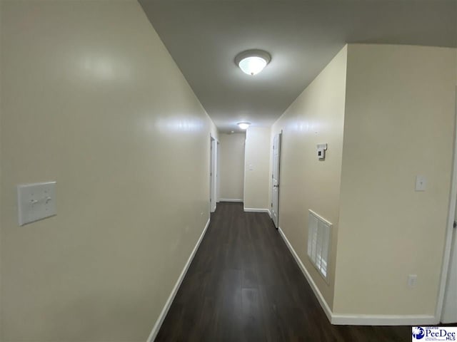 hall with dark hardwood / wood-style floors