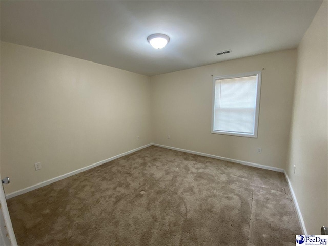 view of carpeted spare room