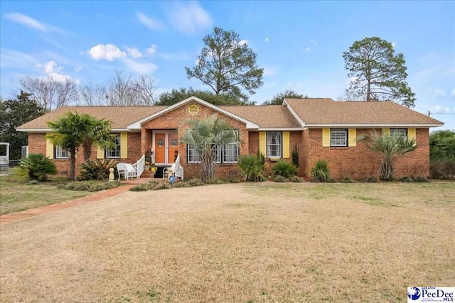 ranch-style home featuring a front yard