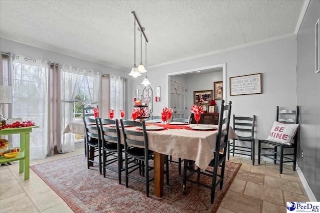 dining area featuring a textured ceiling