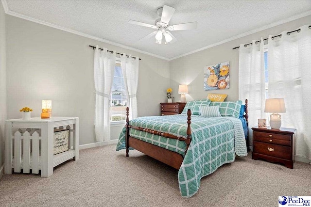 bedroom with ceiling fan, crown molding, a textured ceiling, and carpet flooring