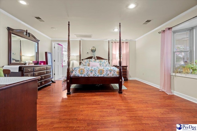 bedroom featuring hardwood / wood-style flooring and ornamental molding