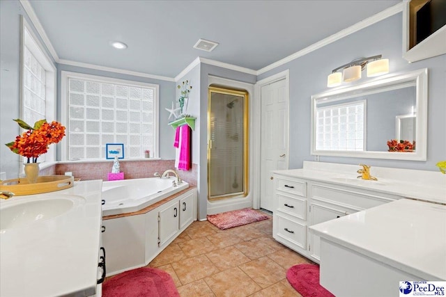 bathroom with tile patterned flooring, crown molding, vanity, and a shower with shower door