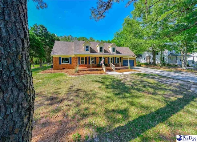 3309 W Forest Lake Dr, Florence, SC 29501 - cape cod house featuring a garage, a front yard, and covered porch