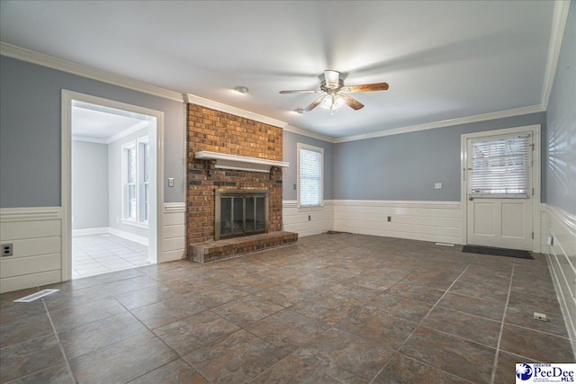 3309 W Forest Lake Dr, Florence, SC 29501 - unfurnished living room with crown molding, a brick fireplace, and ceiling fan
