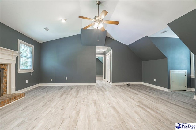 3309 W Forest Lake Dr, Florence, SC 29501 - unfurnished living room with vaulted ceiling, light wood-type flooring, ceiling fan, and a fireplace