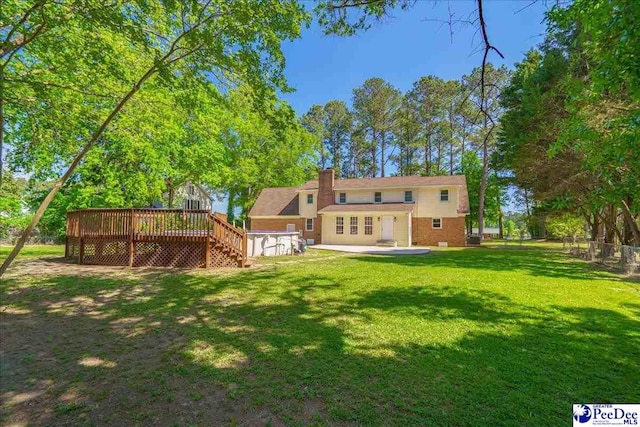 3309 W Forest Lake Dr, Florence, SC 29501 - rear view of property featuring a patio, a deck, and a lawn