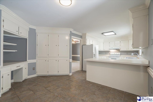3309 W Forest Lake Dr, Florence, SC 29501 - kitchen with white cabinets, white appliances, and kitchen peninsula